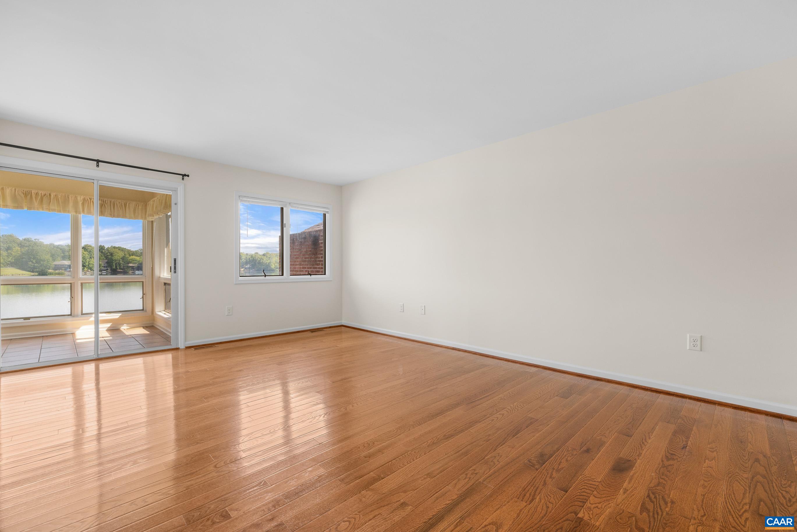 B2 Marina Point Palmyra, VA 22963 - Photo 10 of 37 a view of an empty room with wooden floor and a window