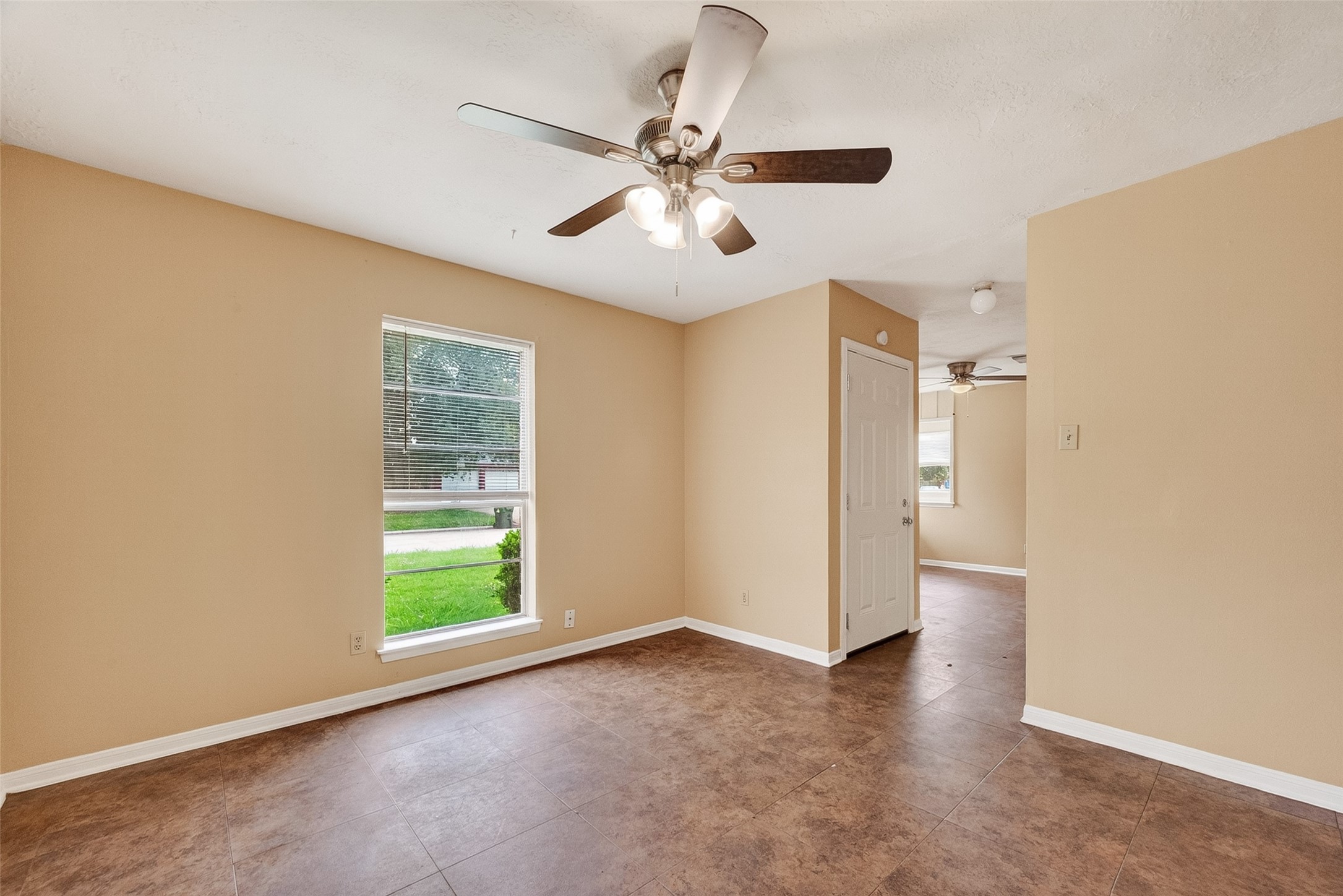 4826 Redfish Reef Drive Bacliff, TX 77518 - Photo 3 of 25 wooden floor in an empty room with a window