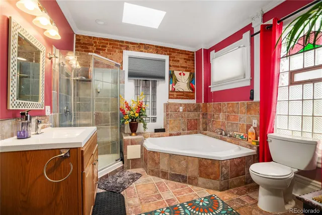a bathroom with a tub shower and a sink