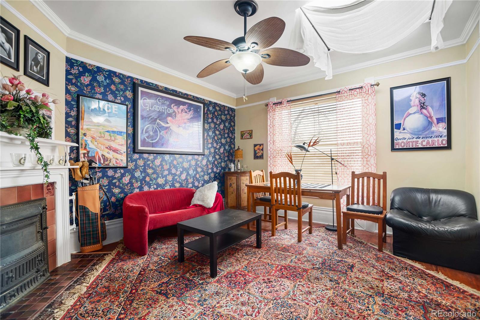 2623 Stout Street Denver, CO 80205 - Photo 25 of 39 a living room with furniture and a chandelier