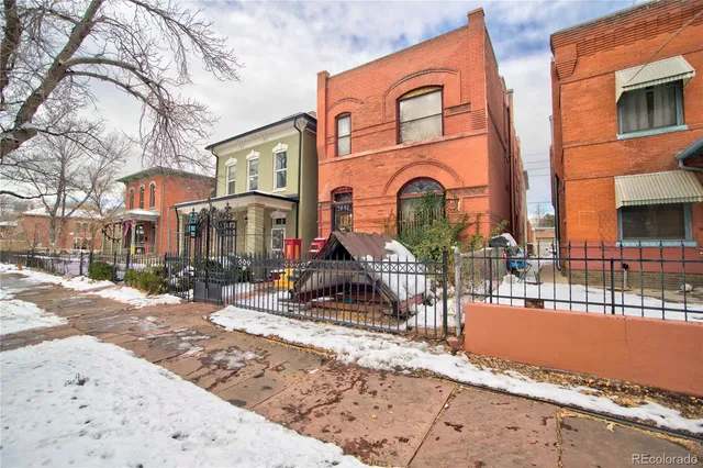 a front view of a building with street view