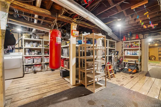 a living room with a rug floor to ceiling window and a wooden floor