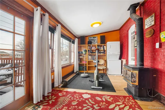 a view of a house with a door and wooden walls