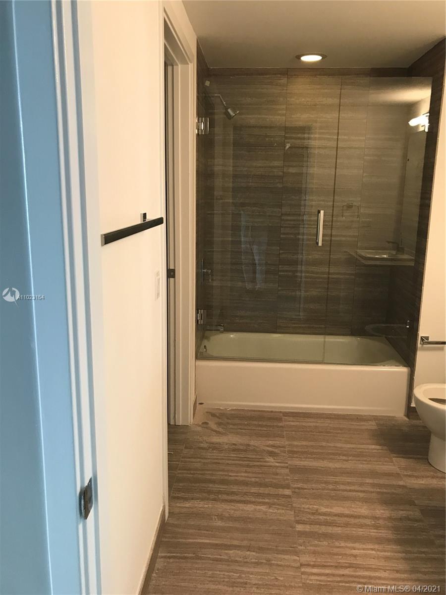 1010 Brickell Avenue, Unit 3204 Miami, FL 33131 - Photo 16 of 32 a bathroom with a shower