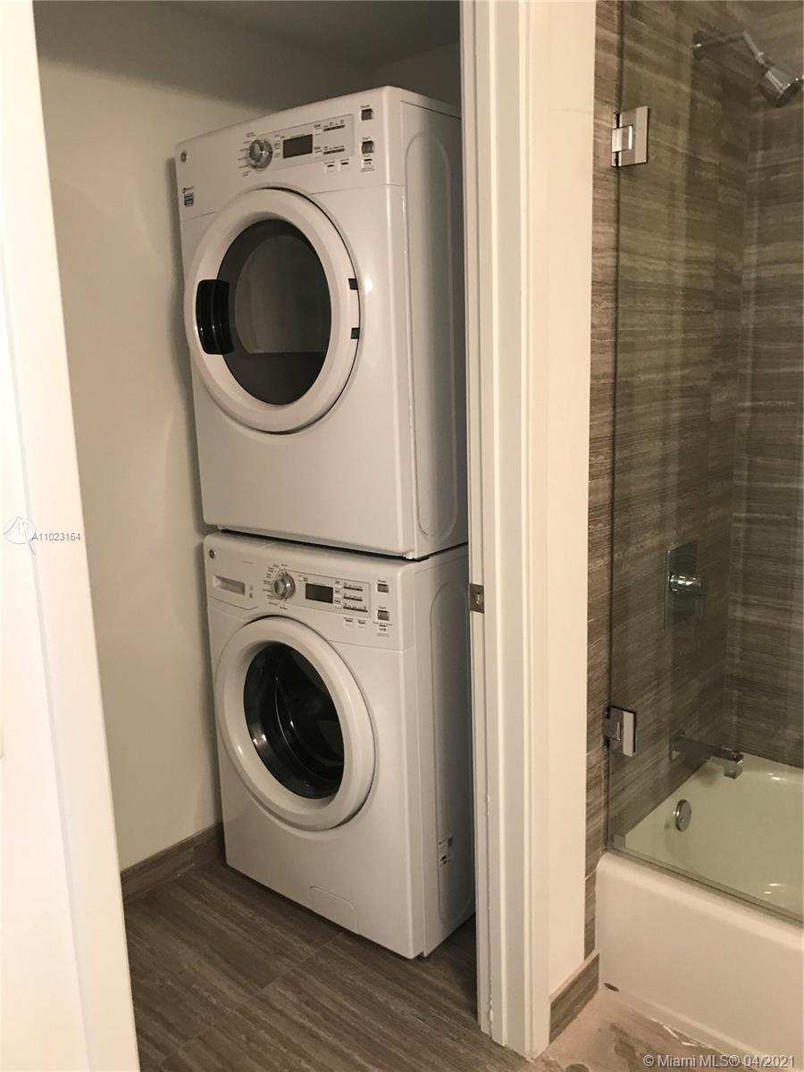 1010 Brickell Avenue, Unit 3204 Miami, FL 33131 - Photo 17 of 32 a utility room with dryer and washer
