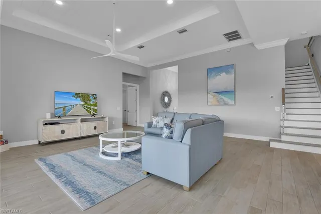 a living room with furniture a rug and a fireplace