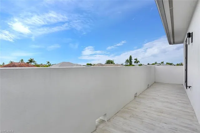 a view of a lake with a table and chairs