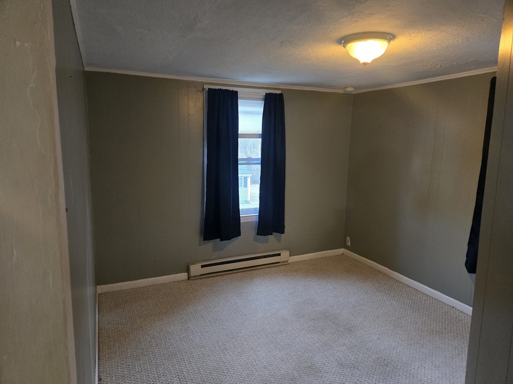 59 Edgehill Road, Unit 2 Taunton, MA 02780 - Photo 13 of 15 an empty room with windows
