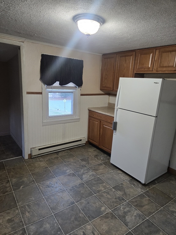 59 Edgehill Road, Unit 2 Taunton, MA 02780 - Photo 3 of 15 a view of kitchen with furniture and white appliances