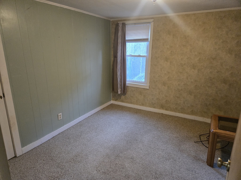 59 Edgehill Road, Unit 2 Taunton, MA 02780 - Photo 10 of 15 a view of an empty room with a window