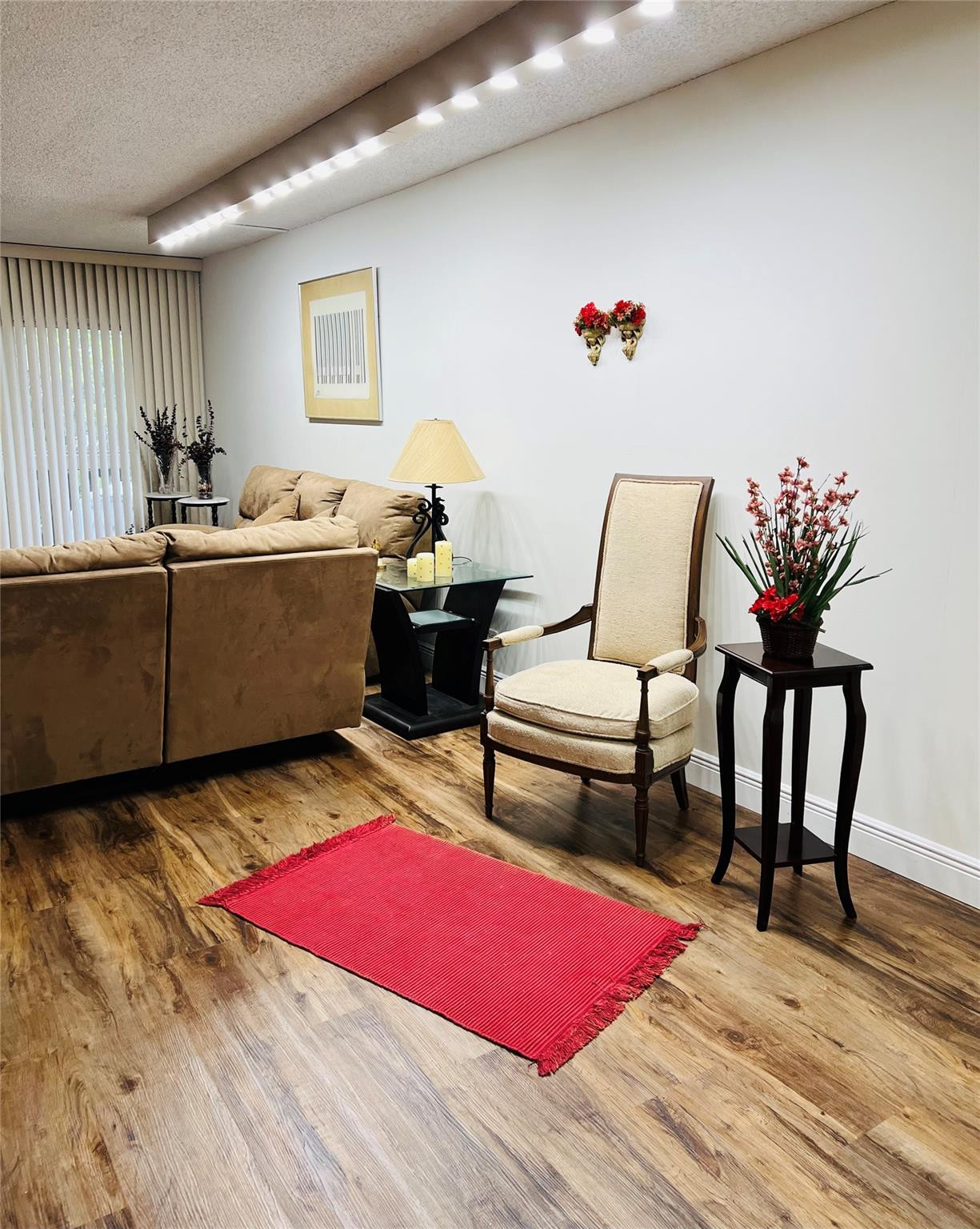 800 Northeast 195th Street, Unit 307 Miami, FL 33179 - Photo 12 of 63 a living room with furniture rug and wooden floor