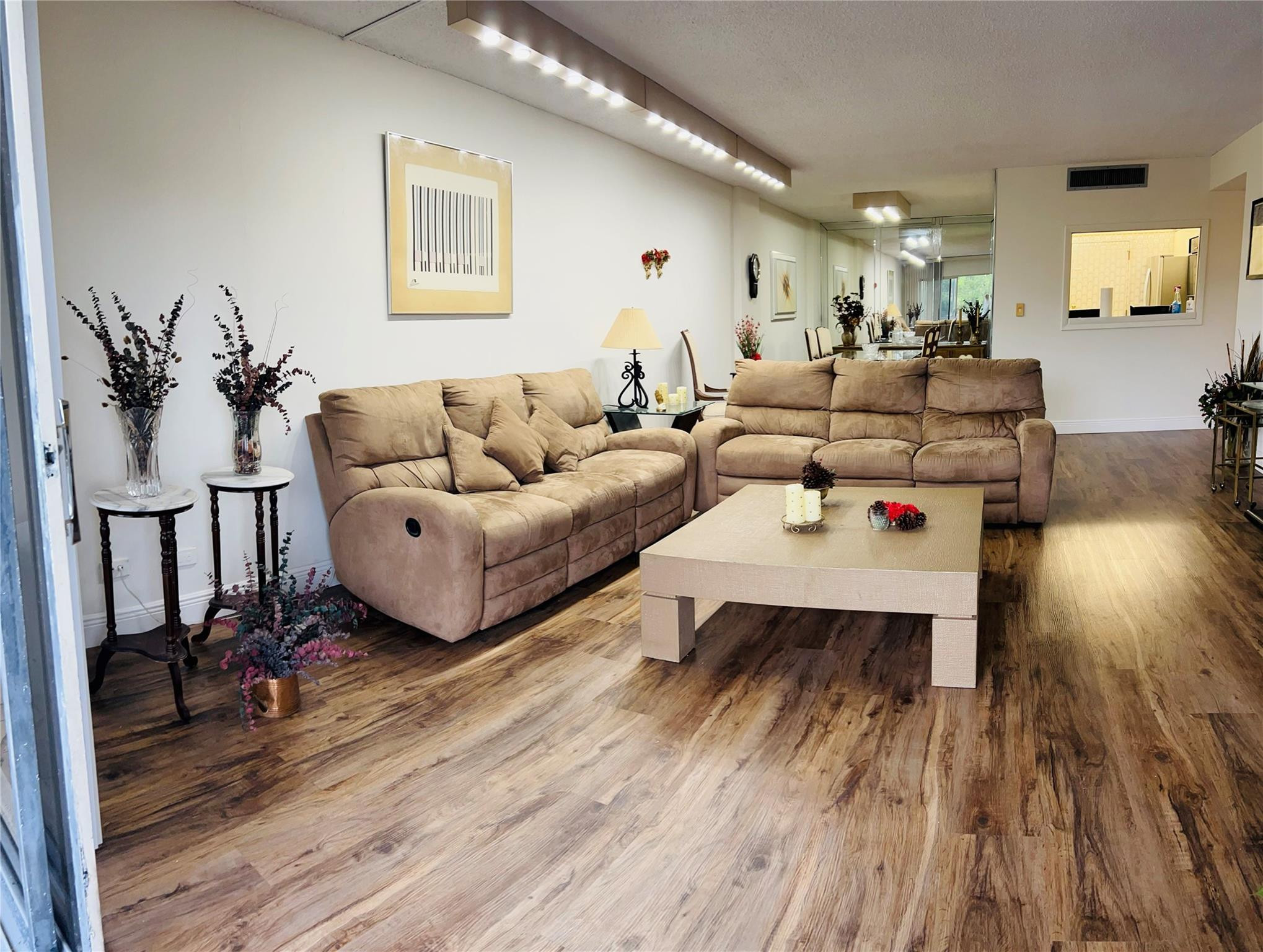 800 Northeast 195th Street, Unit 307 Miami, FL 33179 - Photo 13 of 63 a living room with furniture and wooden floor