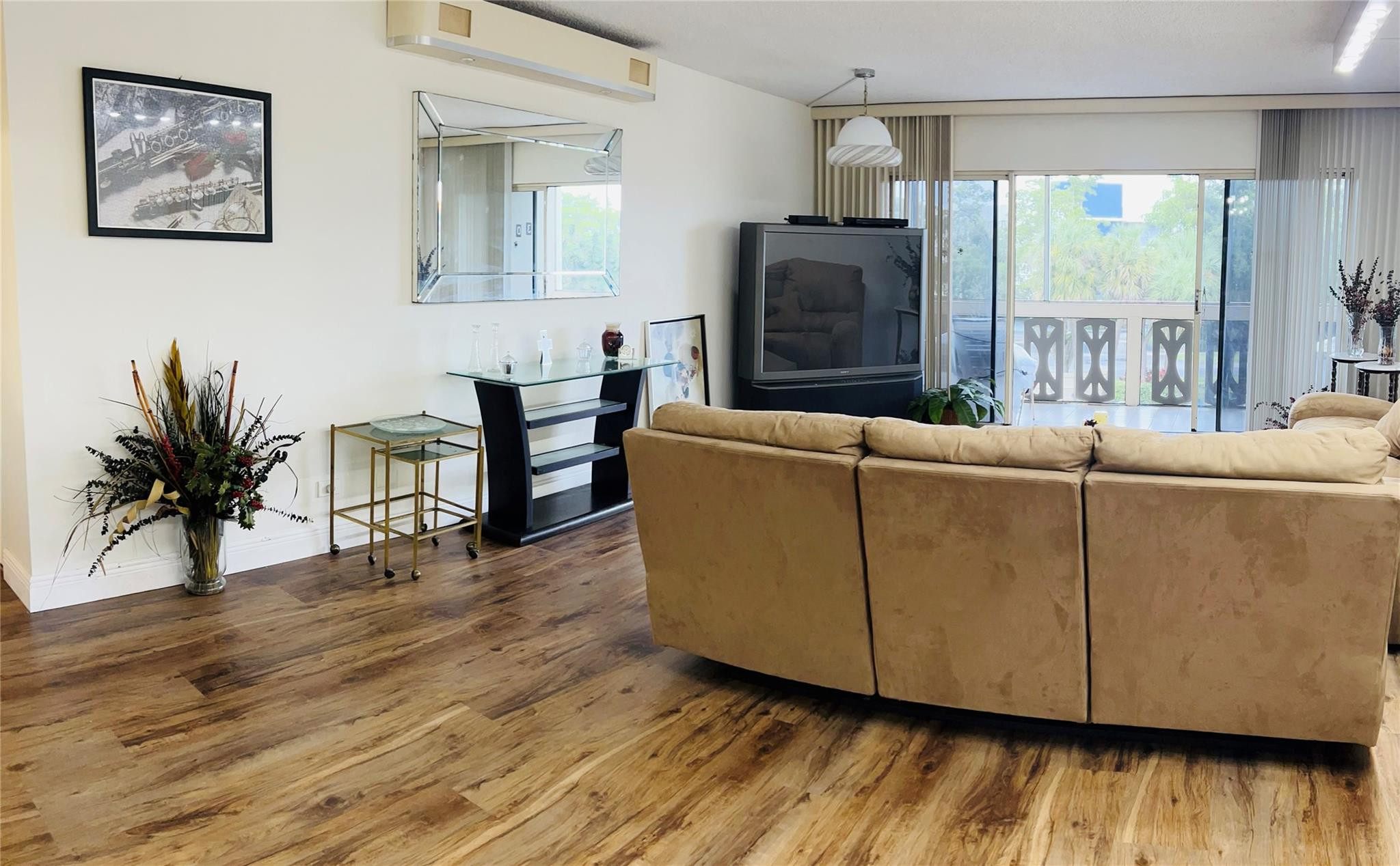 800 Northeast 195th Street, Unit 307 Miami, FL 33179 - Photo 15 of 63 a living room with furniture and a flat screen tv