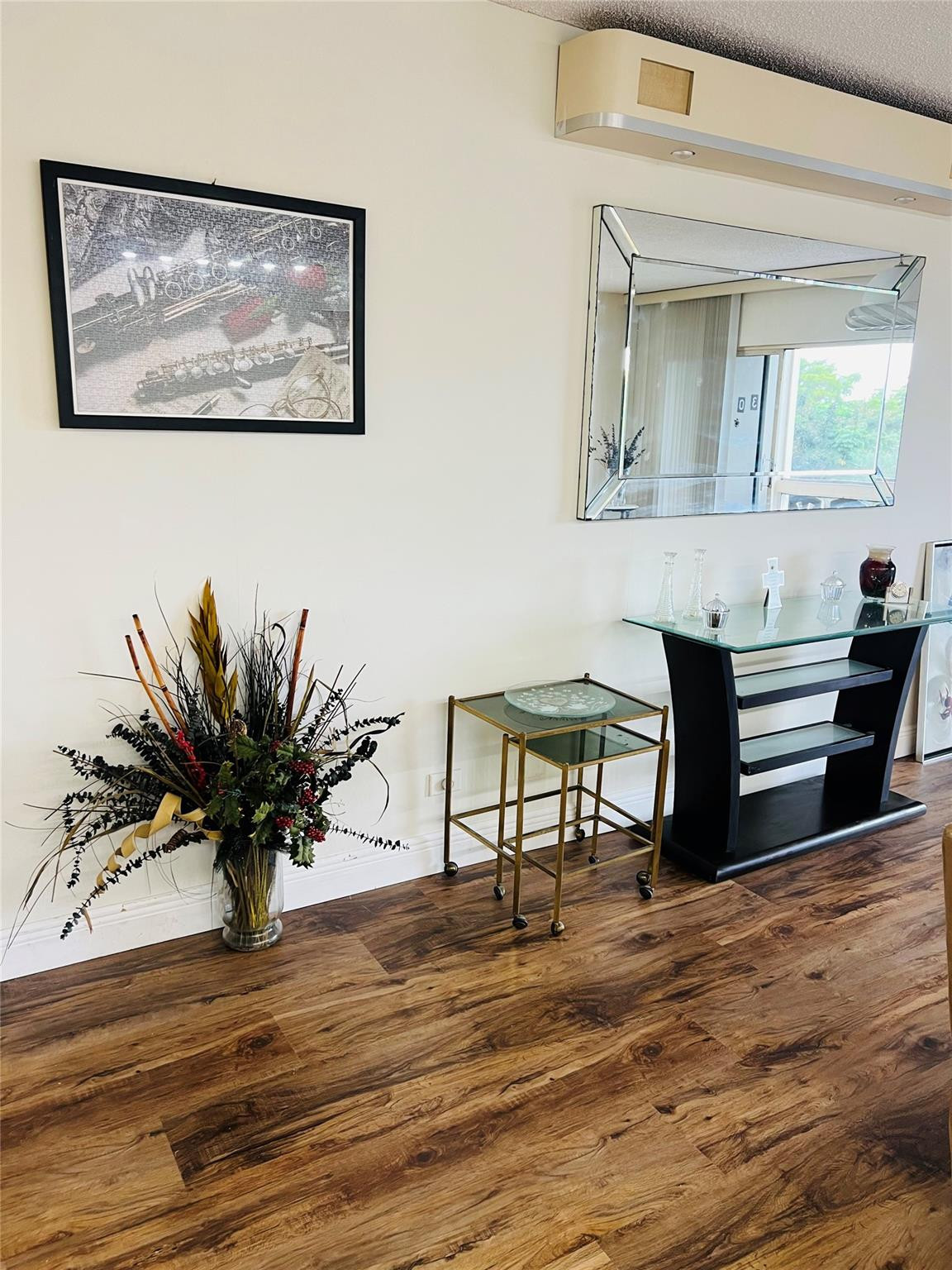 800 Northeast 195th Street, Unit 307 Miami, FL 33179 - Photo 16 of 63 a living room with furniture and a potted plant
