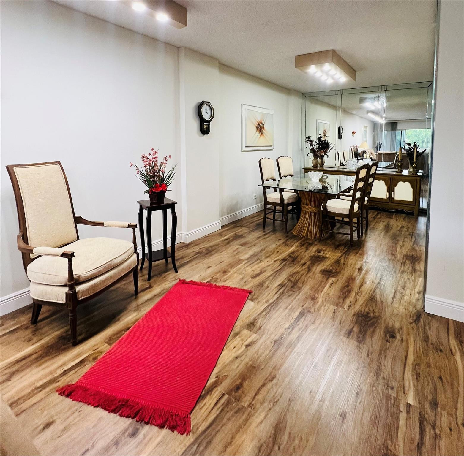 800 Northeast 195th Street, Unit 307 Miami, FL 33179 - Photo 18 of 63 a living room with furniture and wooden floor