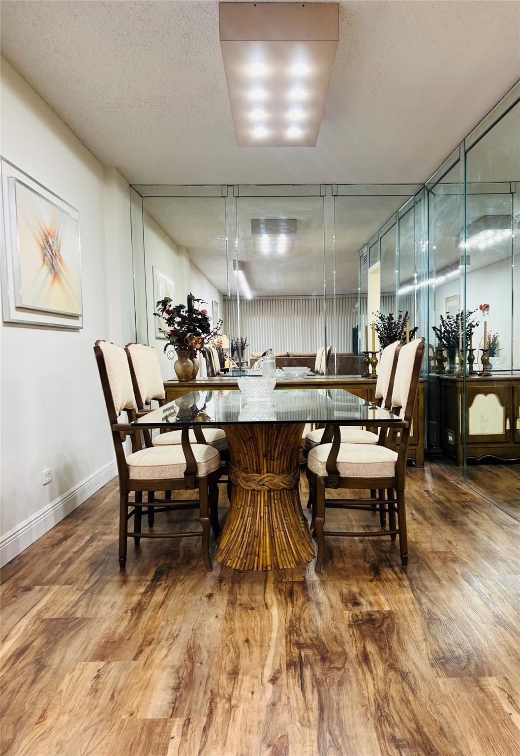 800 Northeast 195th Street, Unit 307 Miami, FL 33179 - Photo 20 of 63 a dining room with furniture and wooden floor