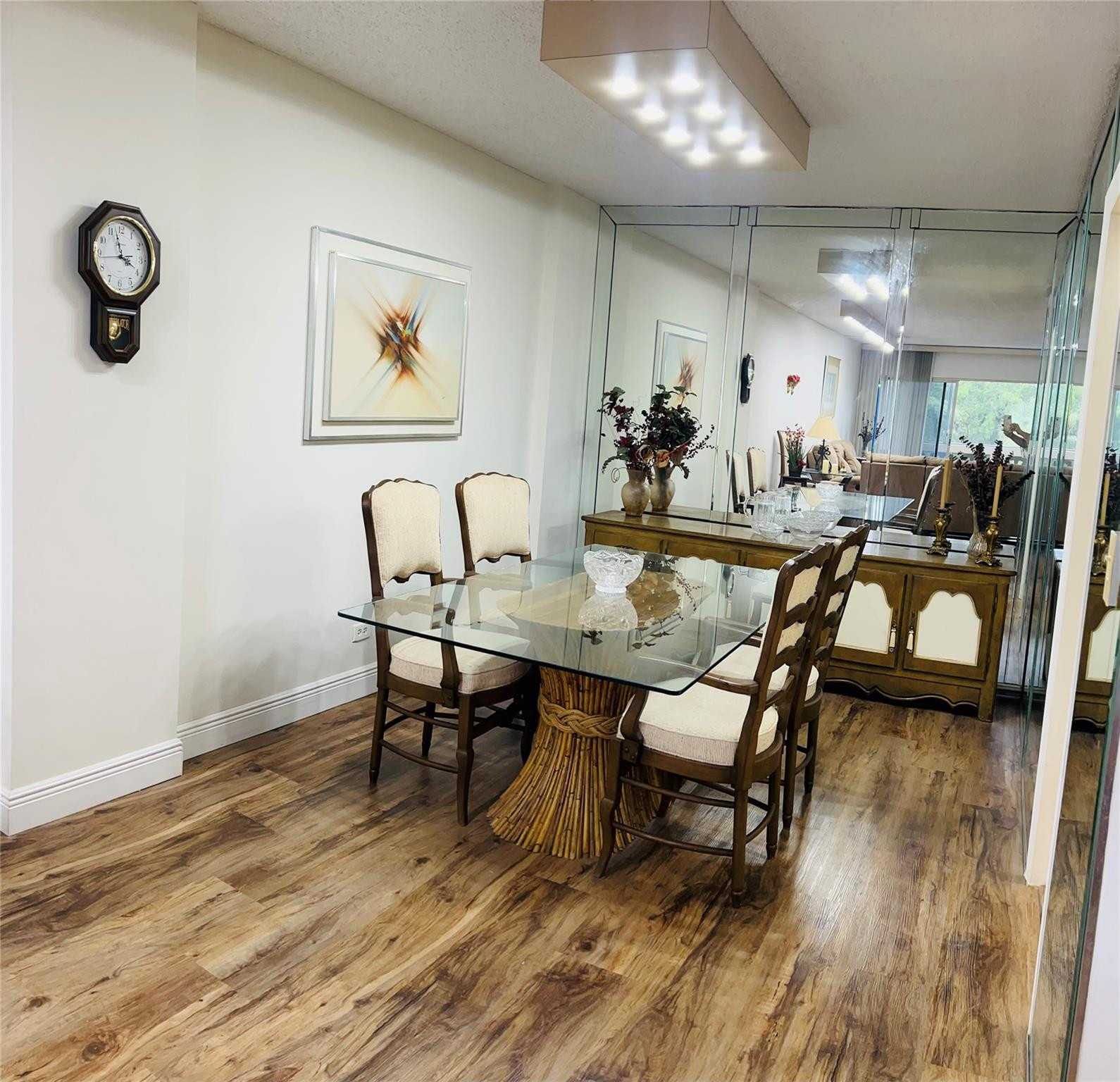 800 Northeast 195th Street, Unit 307 Miami, FL 33179 - Photo 21 of 63 a view of a dining room with furniture and wooden floor