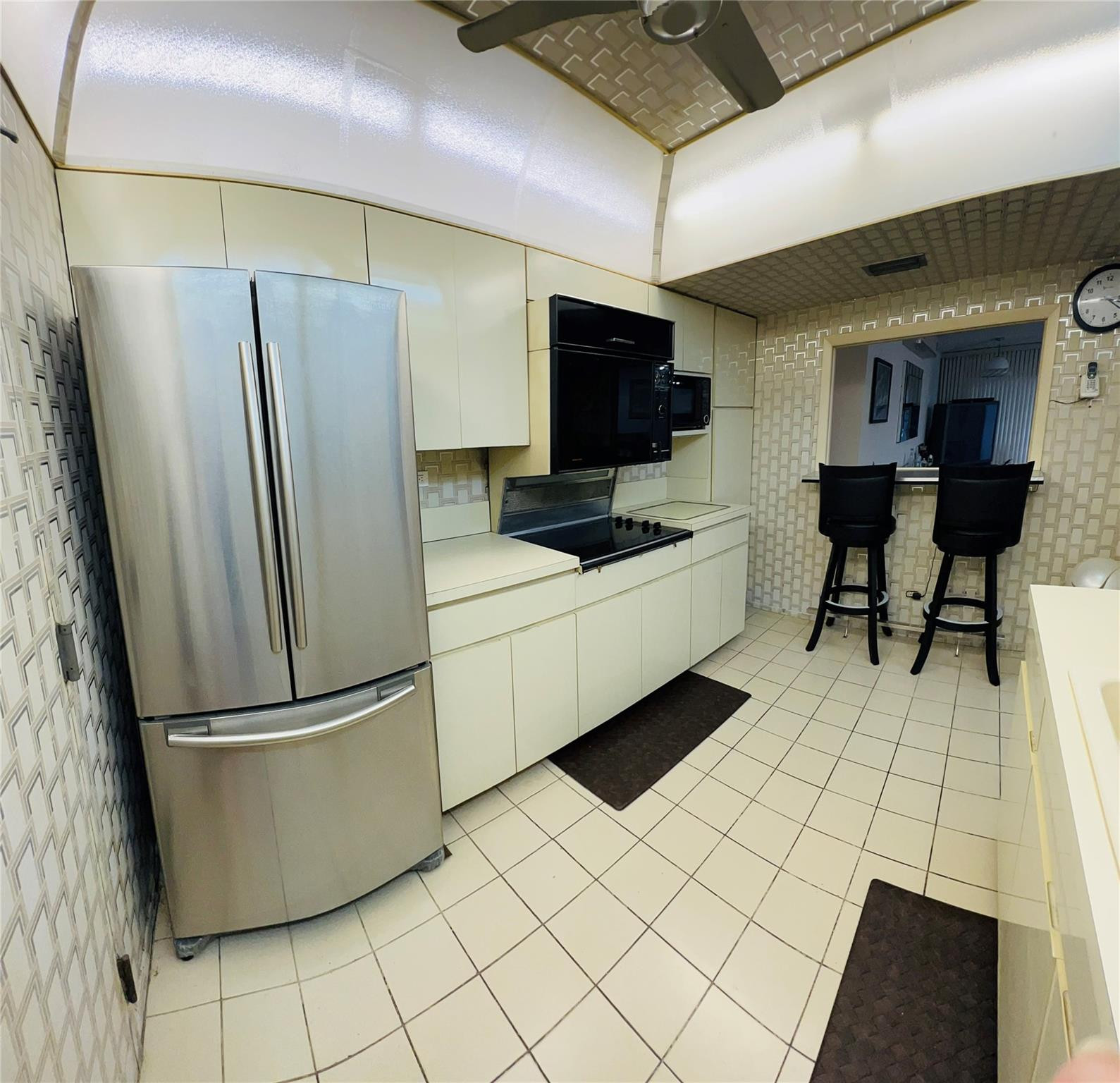 800 Northeast 195th Street, Unit 307 Miami, FL 33179 - Photo 25 of 63 a kitchen with stainless steel appliances a refrigerator sink and microwave