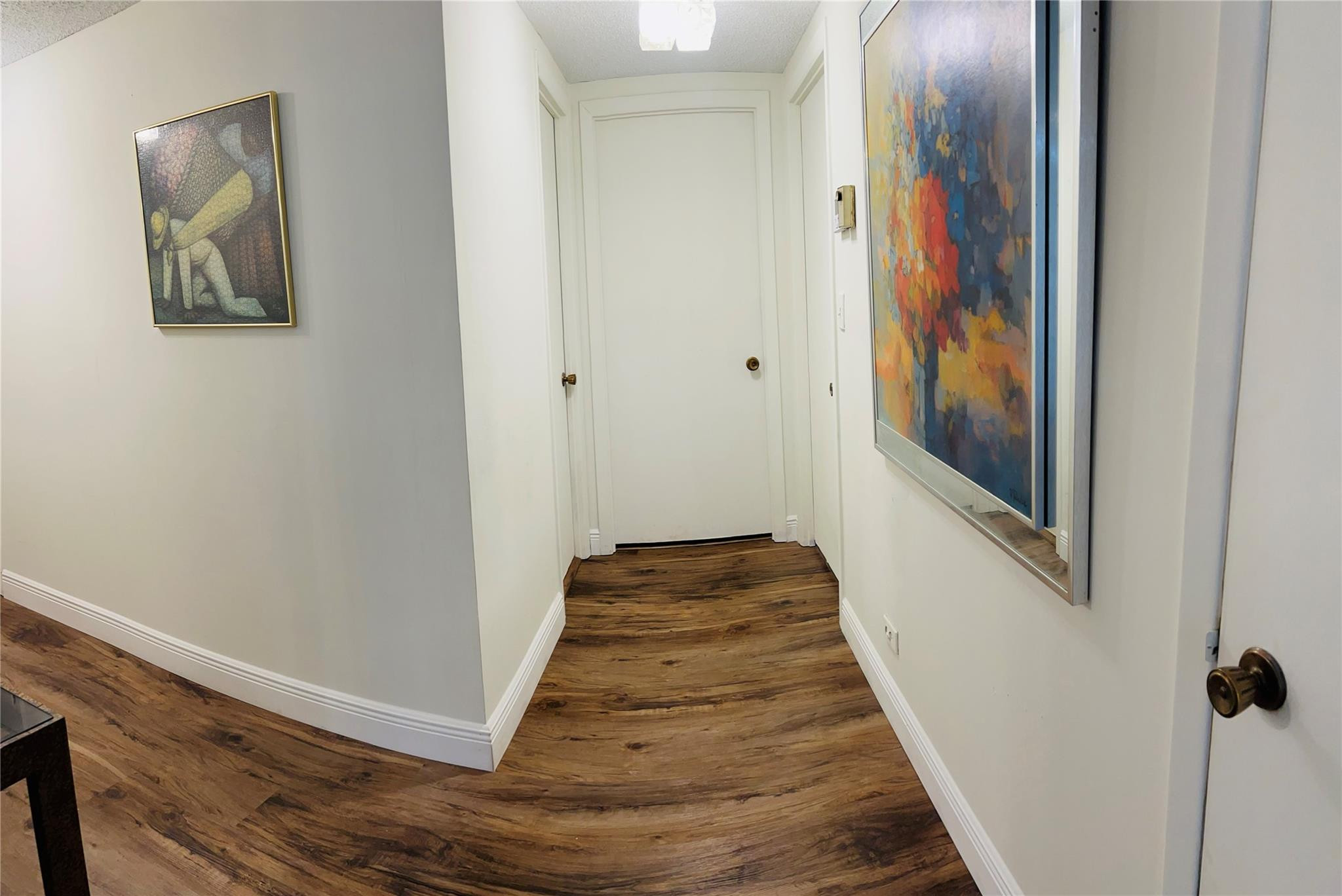 800 Northeast 195th Street, Unit 307 Miami, FL 33179 - Photo 27 of 63 a view of a hallway with wooden floor and staircase
