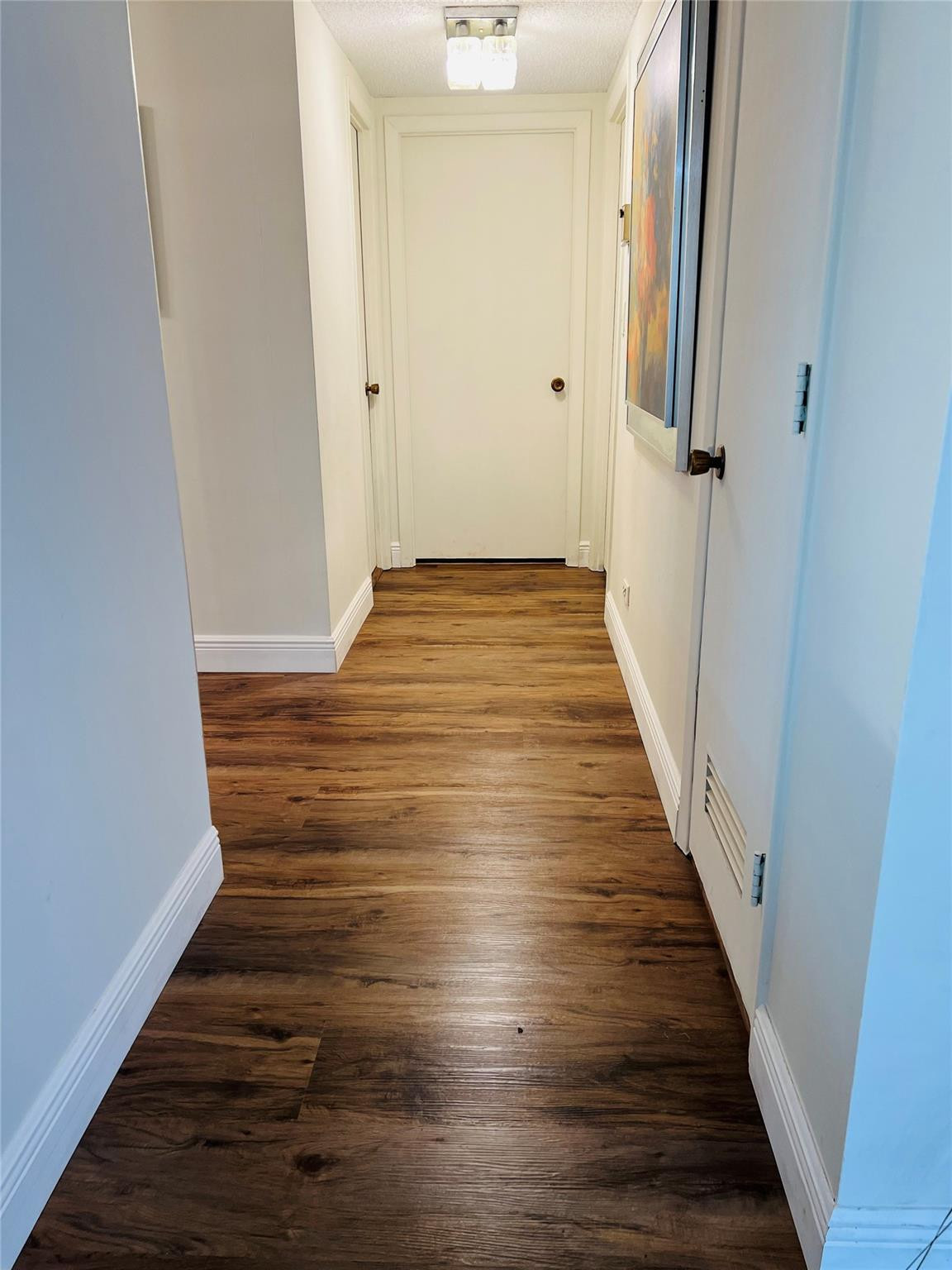 800 Northeast 195th Street, Unit 307 Miami, FL 33179 - Photo 28 of 63 a view of a hallway with wooden floor and staircase