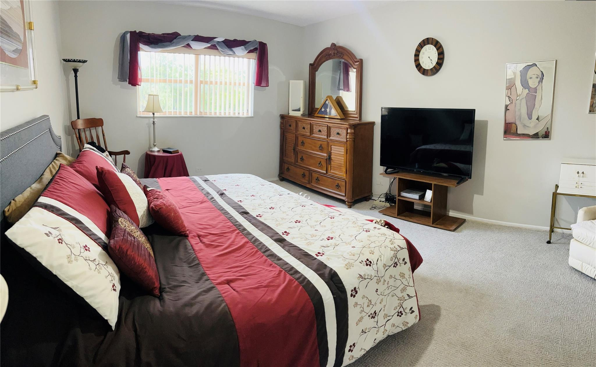 800 Northeast 195th Street, Unit 307 Miami, FL 33179 - Photo 31 of 63 a bedroom with a bed and a flat screen tv