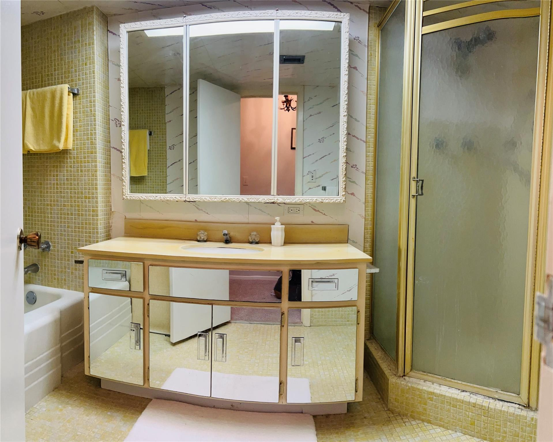 800 Northeast 195th Street, Unit 307 Miami, FL 33179 - Photo 36 of 63 a bathroom with a granite countertop sink and a mirror