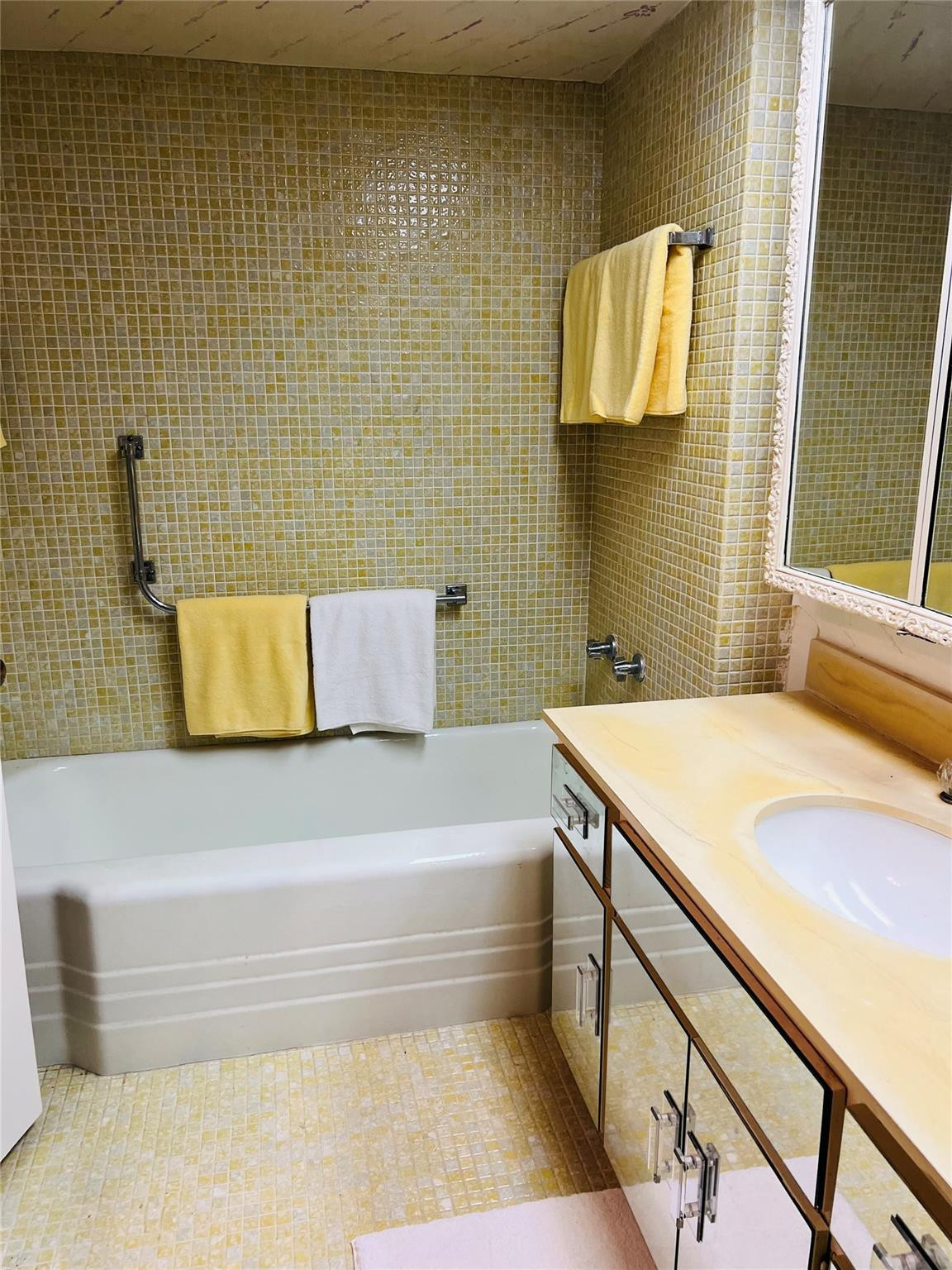 800 Northeast 195th Street, Unit 307 Miami, FL 33179 - Photo 40 of 63 a bathroom with a bathtub and a shower