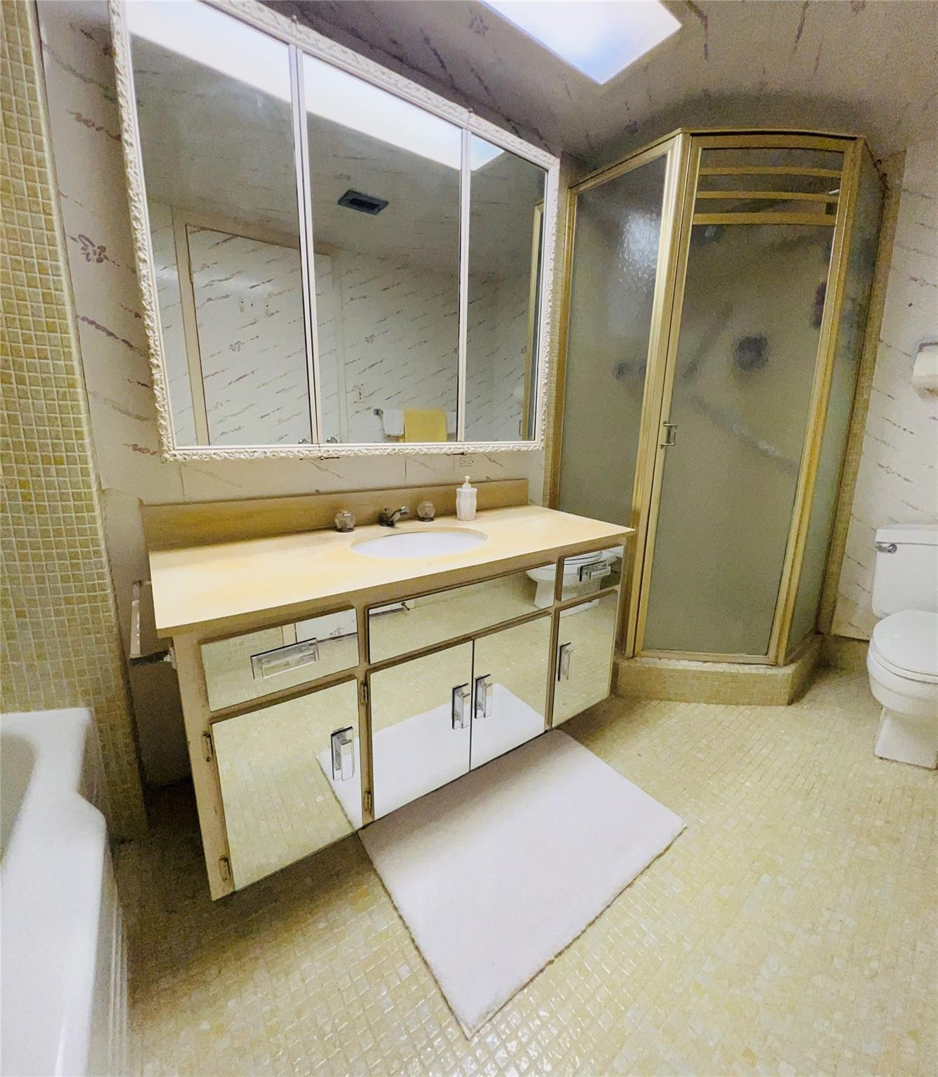800 Northeast 195th Street, Unit 307 Miami, FL 33179 - Photo 42 of 63 a bathroom with a sink a mirror and a shower