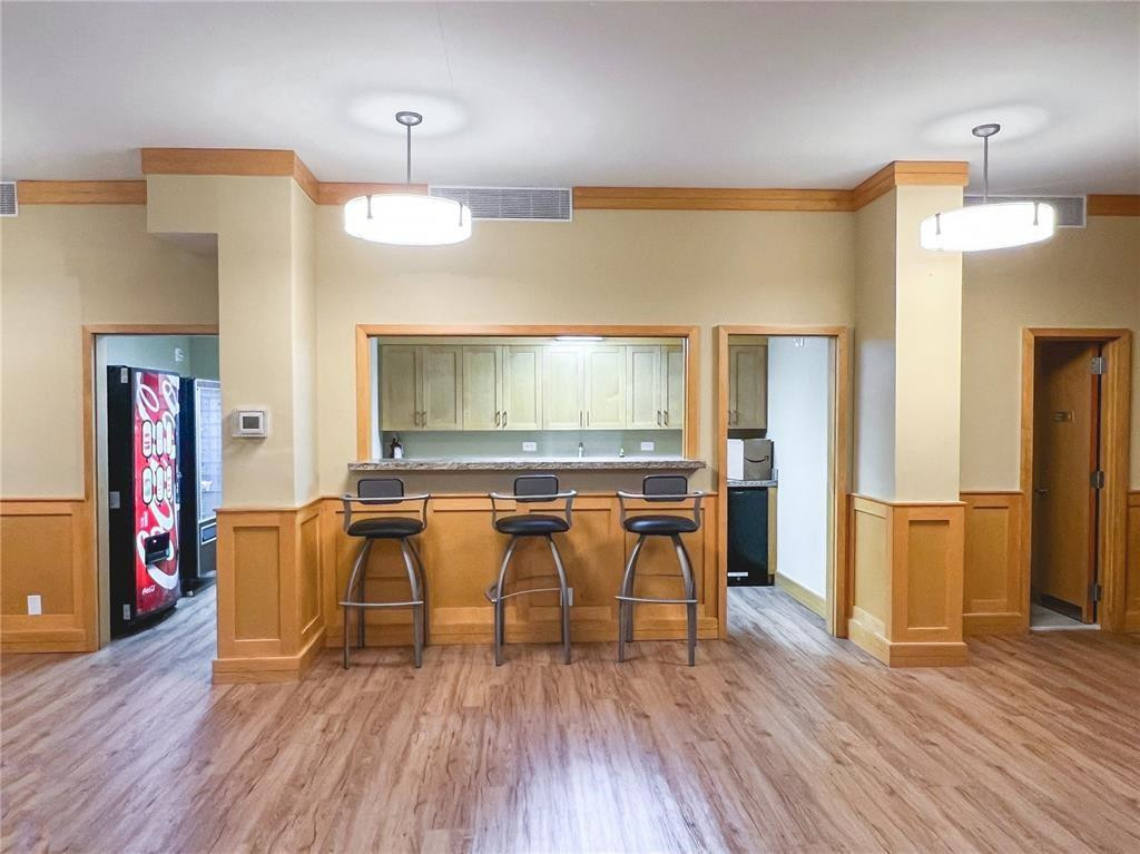 800 Northeast 195th Street, Unit 307 Miami, FL 33179 - Photo 54 of 63 a view of a dining room with furniture and wooden floor