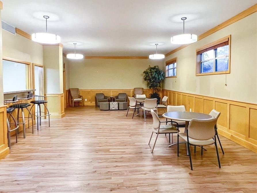800 Northeast 195th Street, Unit 307 Miami, FL 33179 - Photo 56 of 63 a view of a dining room with furniture and wooden floor