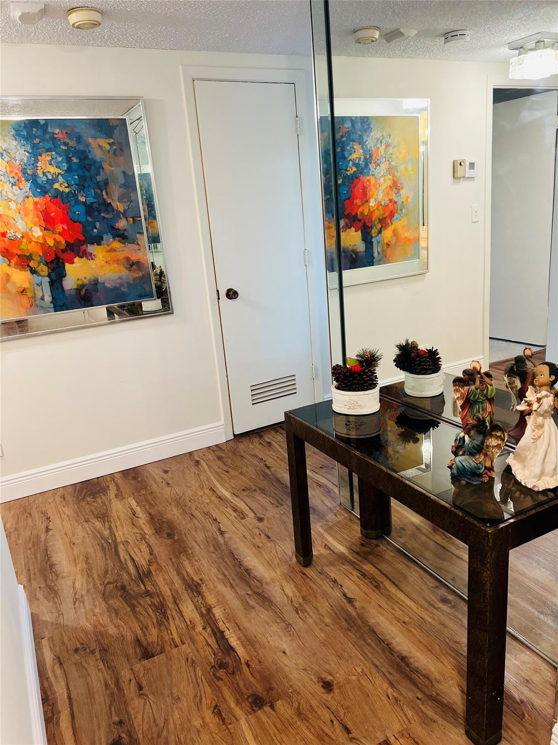 800 Northeast 195th Street, Unit 307 Miami, FL 33179 - Photo 8 of 63 a view of a workspace with furniture and wooden floor