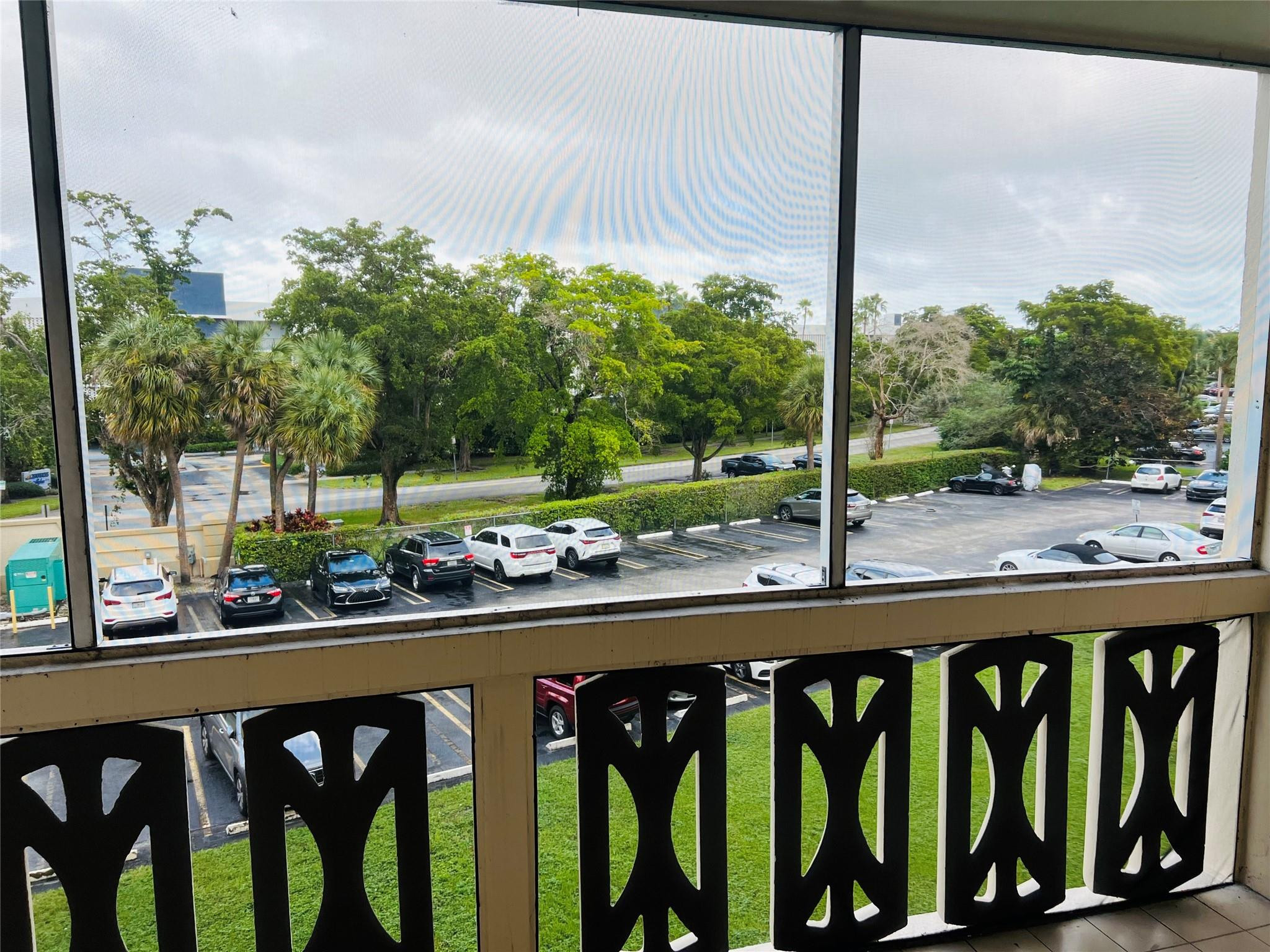800 Northeast 195th Street, Unit 307 Miami, FL 33179 - Photo 10 of 63 a view of a street from a balcony