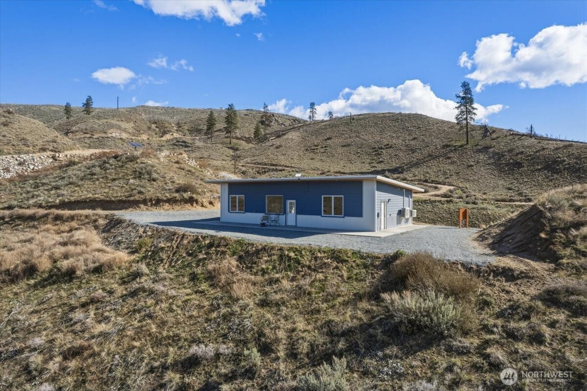 2 Island View Lane Methow, WA 98834 - Photo 8 of 35 a view of a fireplace with a yard