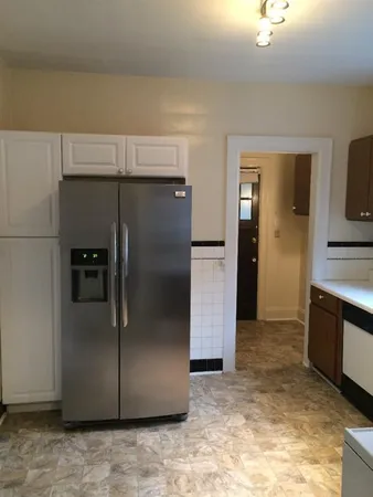 a view of a refrigerator in kitchen and a refrigerator