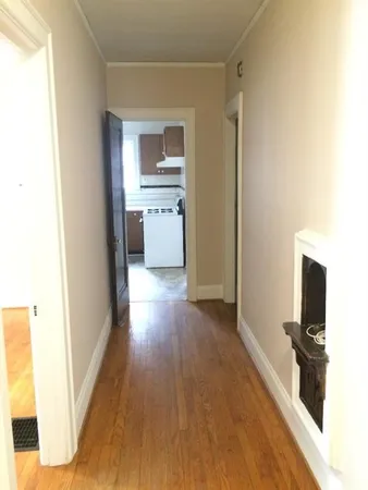 a view of a kitchen cabinets and wooden floor