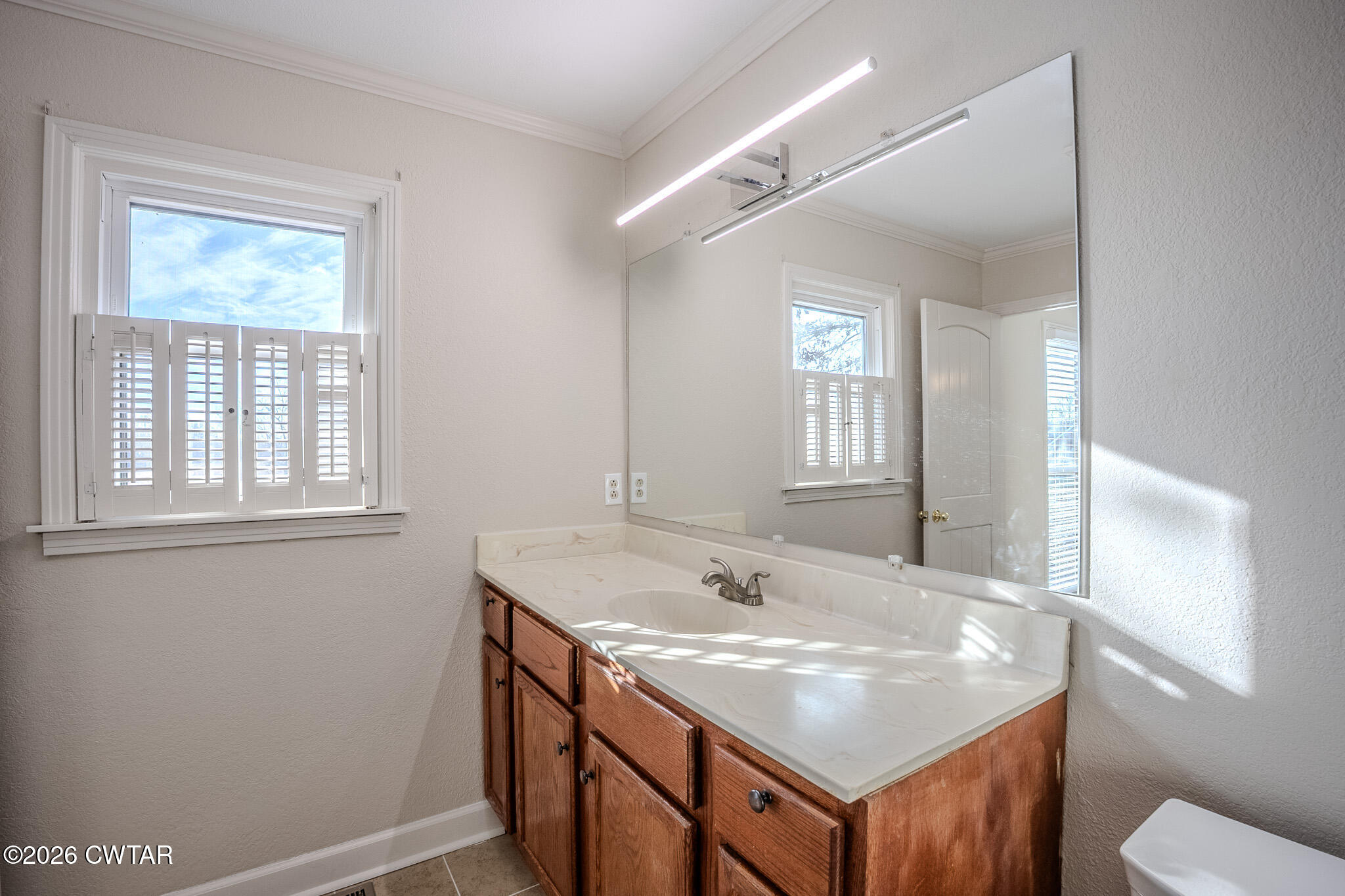2467 Windrow Road Brownsville, TN 38012 - Photo 17 of 32 a bathroom with a sink and a mirror