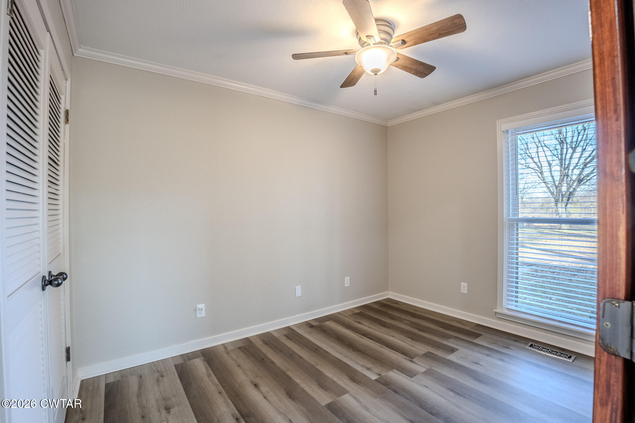 2467 Windrow Road Brownsville, TN 38012 - Photo 20 of 32 wooden floor in an empty room with a window