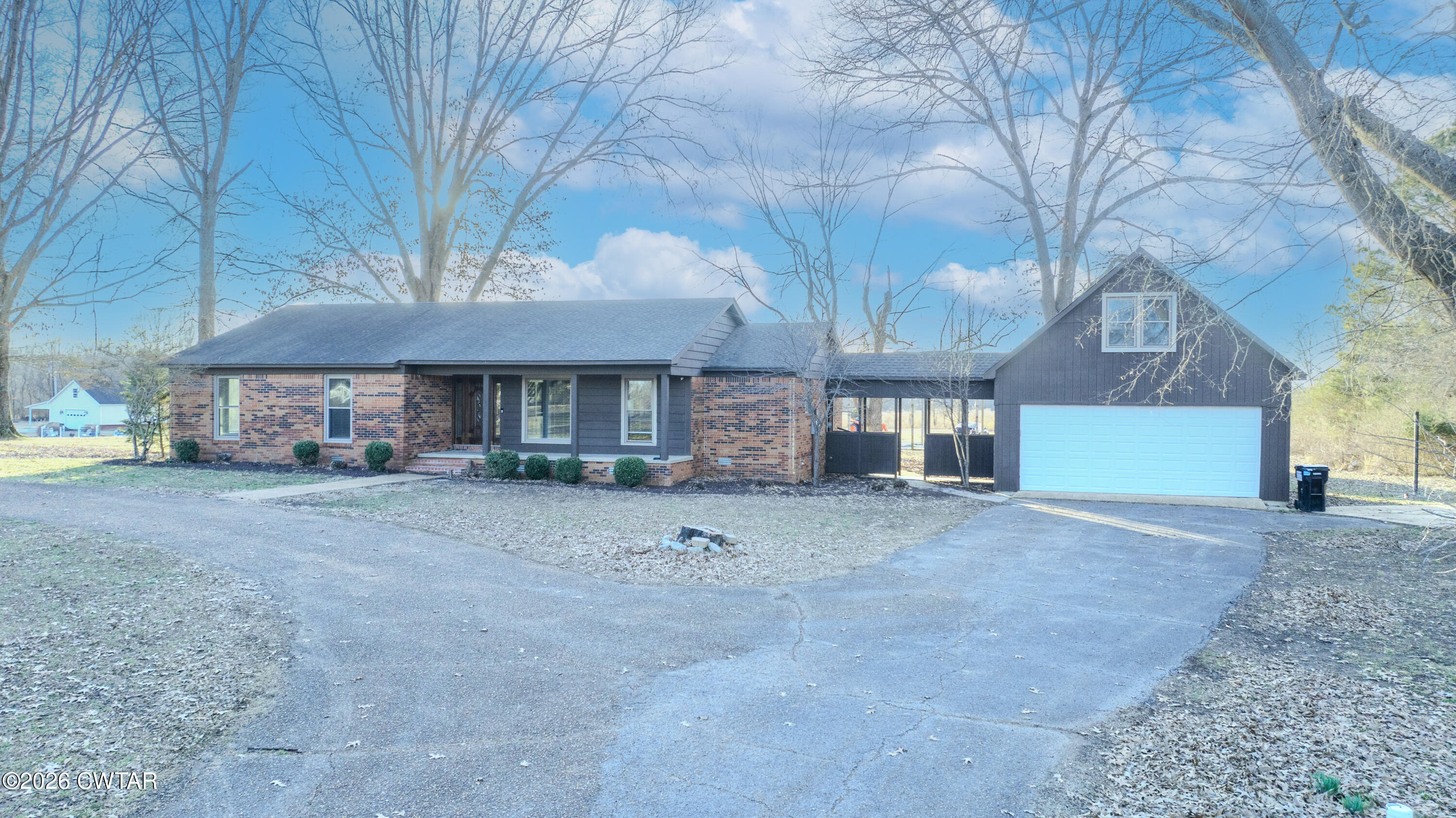 2467 Windrow Road Brownsville, TN 38012 - Photo 28 of 32 a view of a house with a yard and large tree