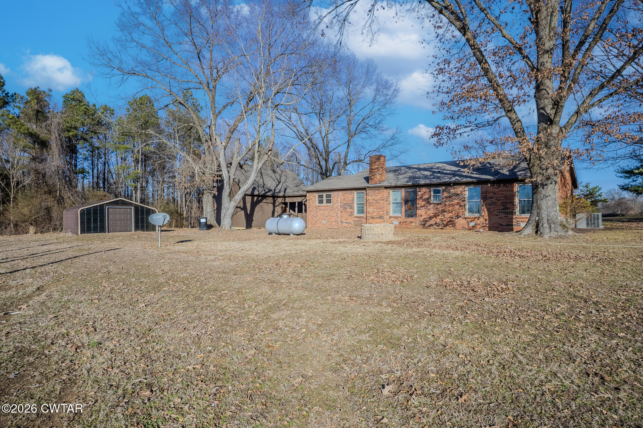2467 Windrow Road Brownsville, TN 38012 - Photo 30 of 32 a view of street with large trees
