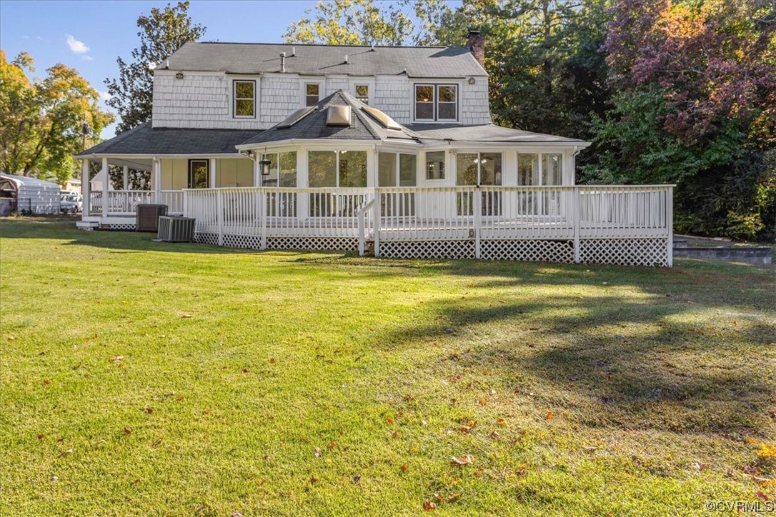 13220 Hollis Road Chester, VA 23831 - Photo 33 of 33 a view of a large pool with lawn chairs and plants