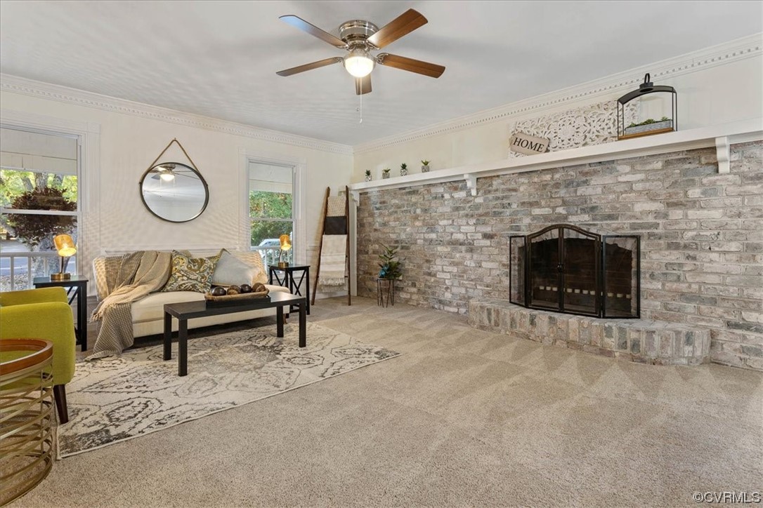 13220 Hollis Road Chester, VA 23831 - Photo 8 of 33 a living room with furniture and a fireplace