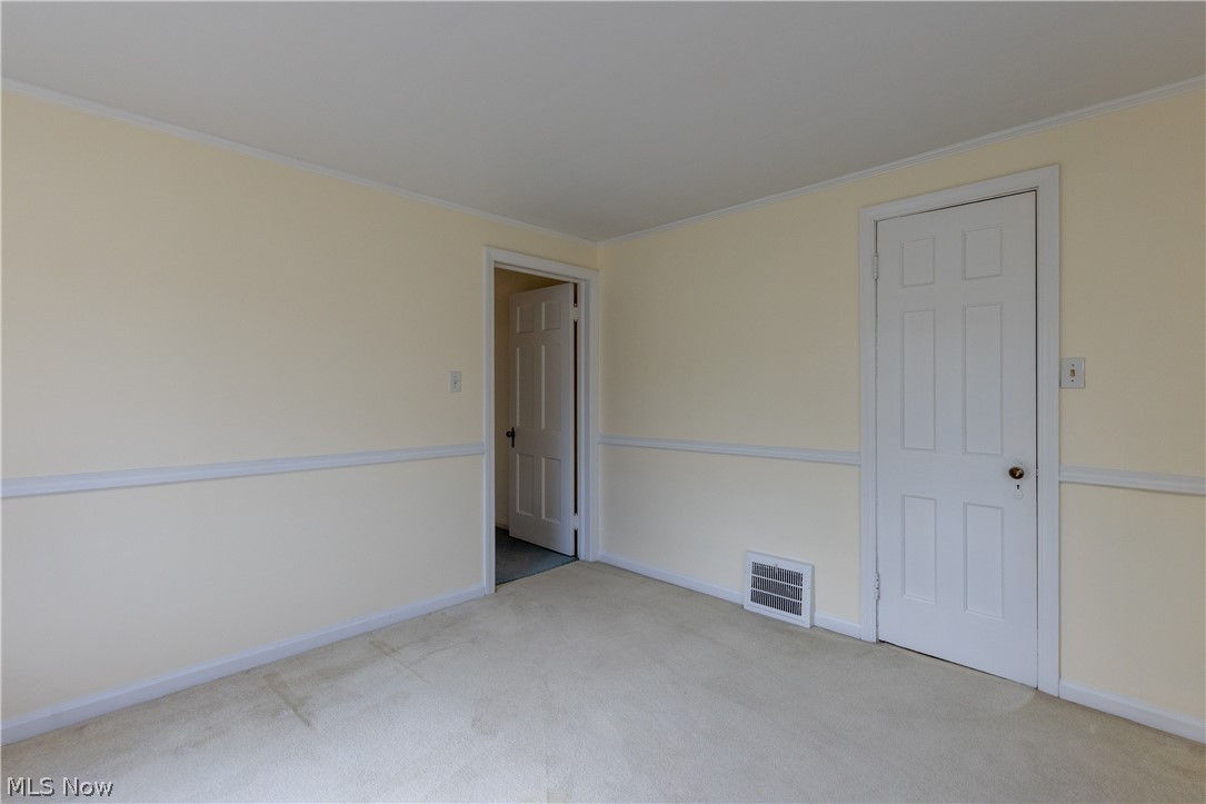 1050 Renfield Road Cleveland Heights, OH 44121 - Photo 20 of 41 Unfurnished bedroom featuring light carpet and ornamental molding