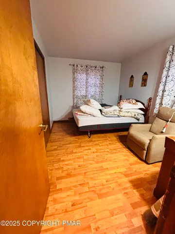 a bedroom with furniture and a bed