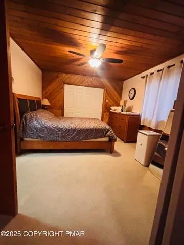 a bedroom with bed and window