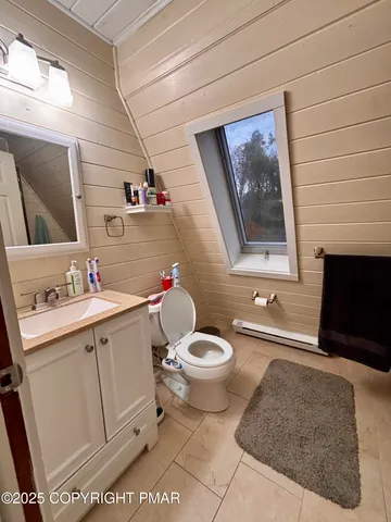 wooden floor with table and chairs