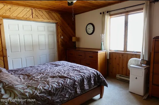 a kitchen with a stove and a wooden floor