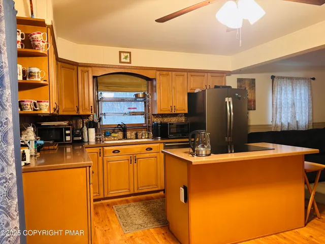 a dining room with furniture and chandelier