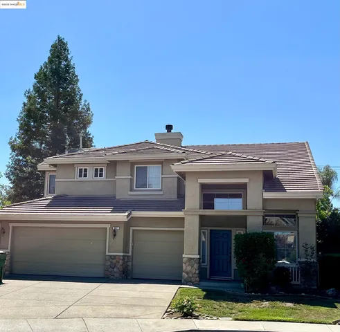 a front view of a house with yard