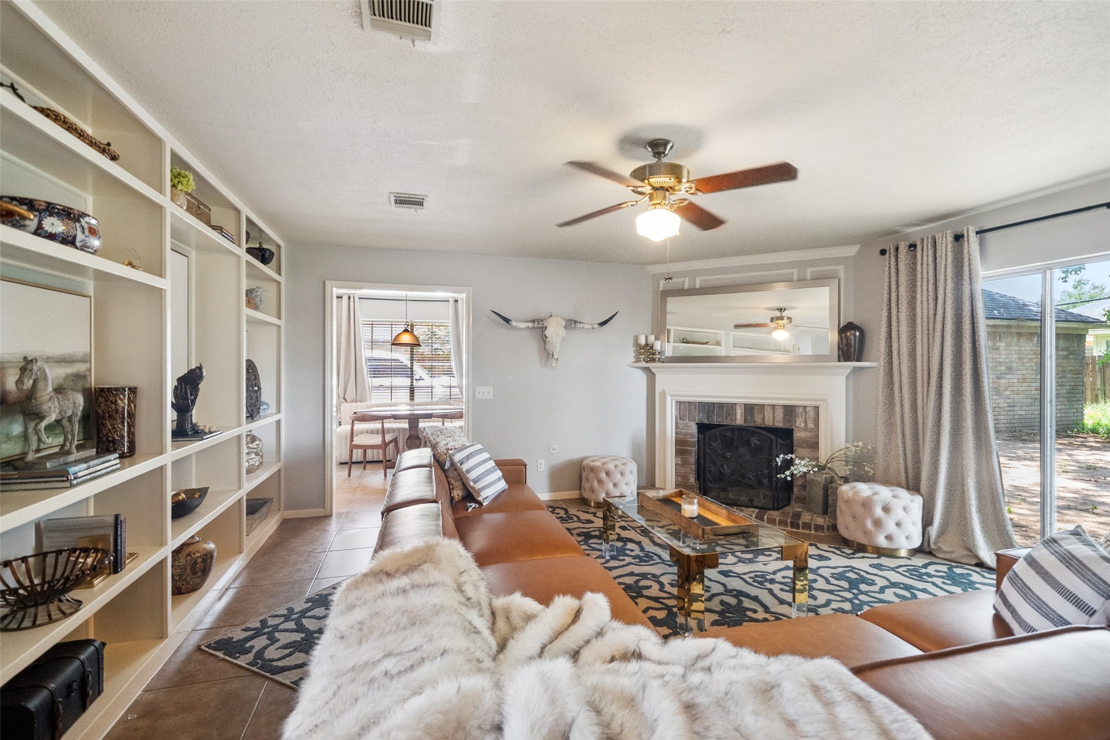 20407 Weald Way Street Spring, TX 77388 - Photo 13 of 31 a living room with furniture and a fireplace