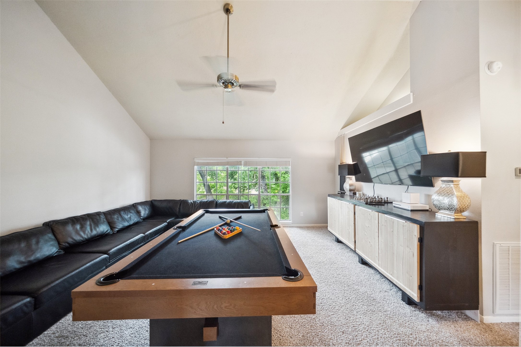 20407 Weald Way Street Spring, TX 77388 - Photo 21 of 31 a room with furniture a window and a chandelier